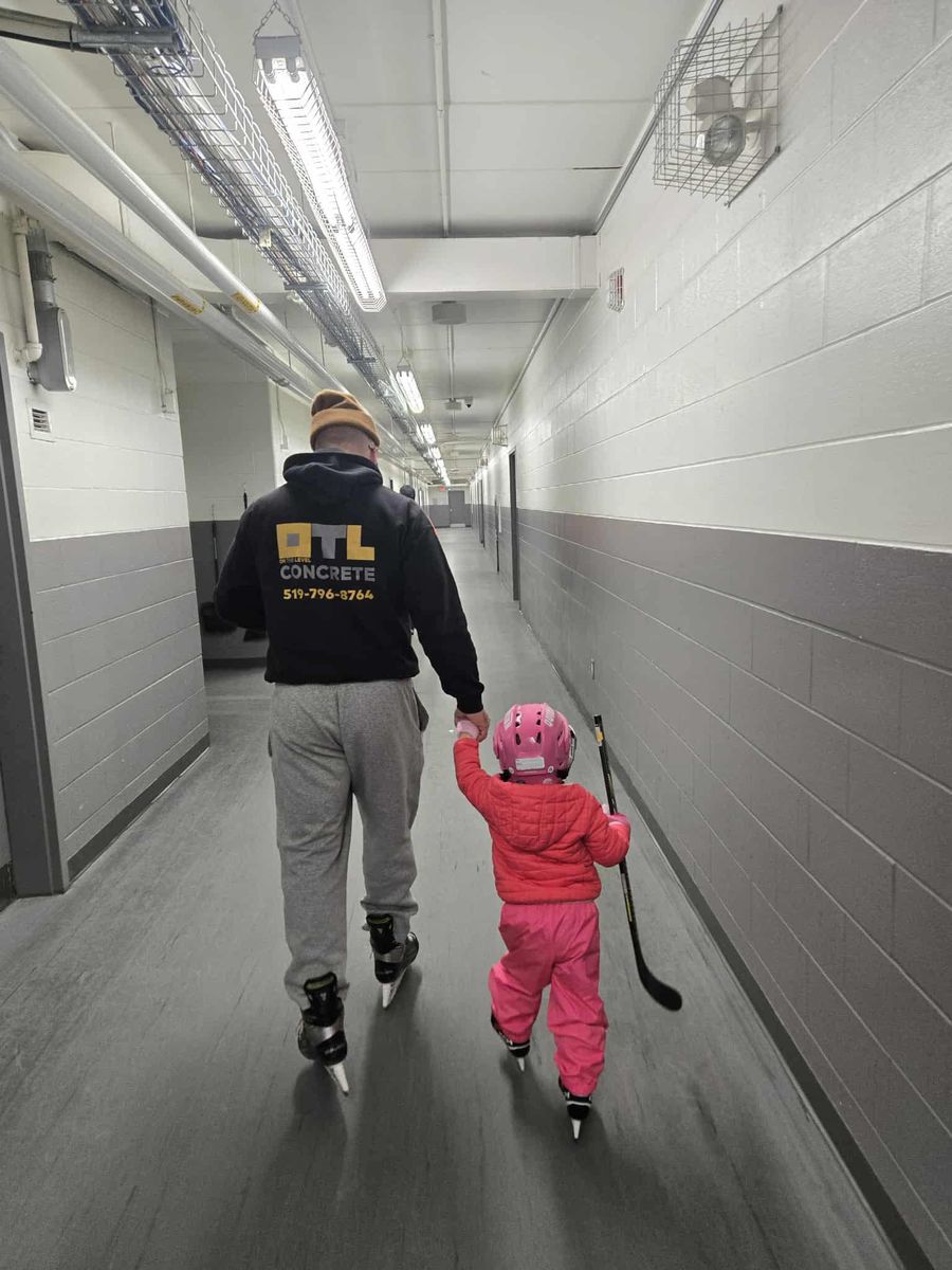 OTL hoodie at the local rink — crew member skating with his daughter