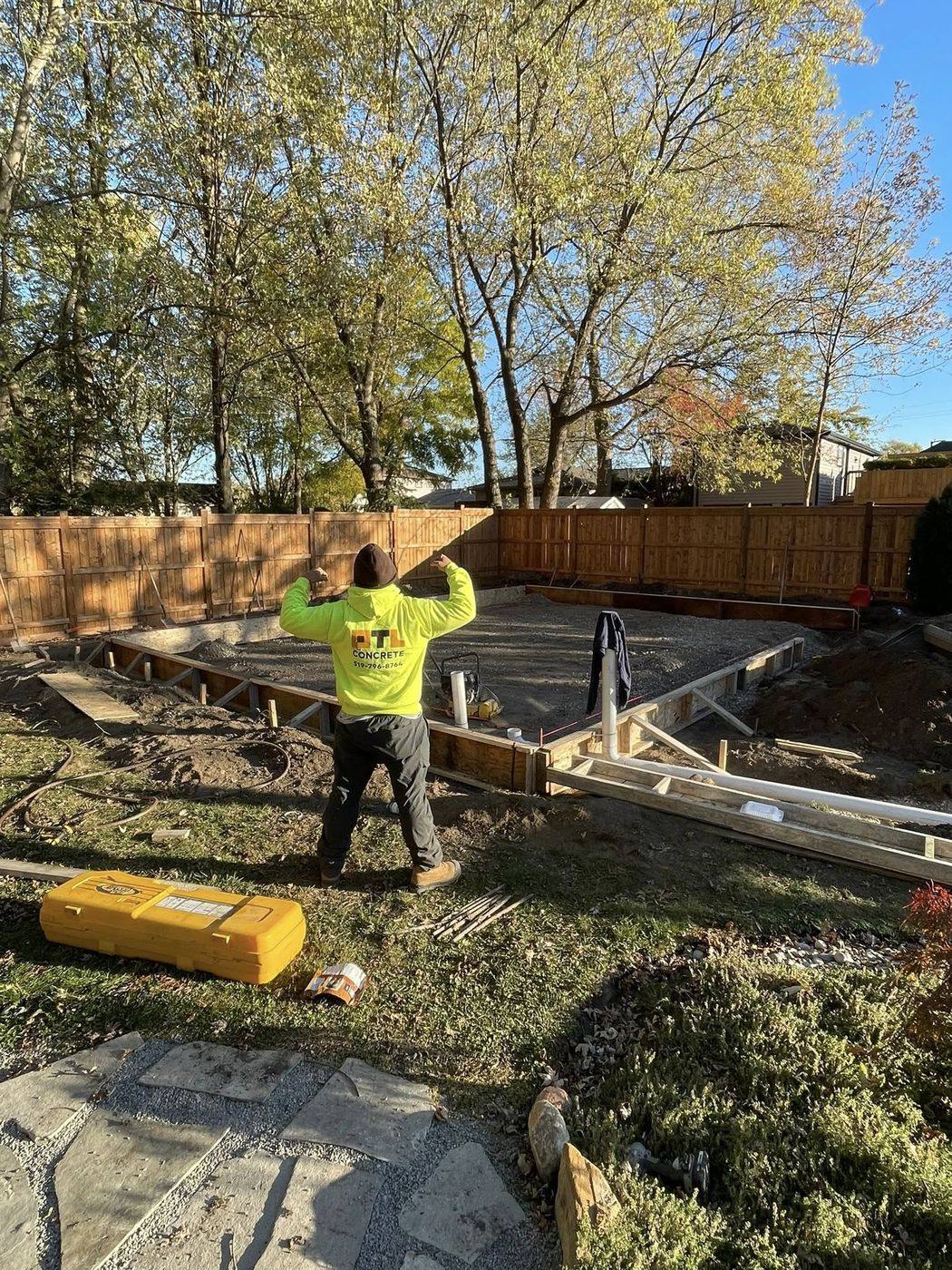 OTL crew in branded gear setting forms on site