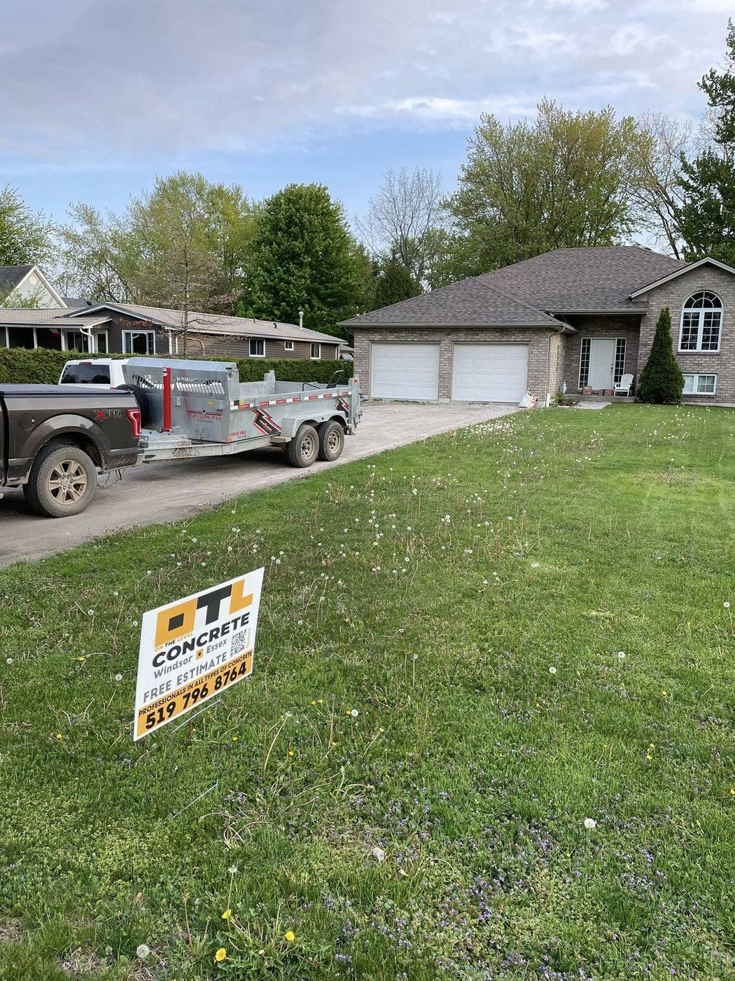 OTL truck, trailer and site sign at a finished driveway