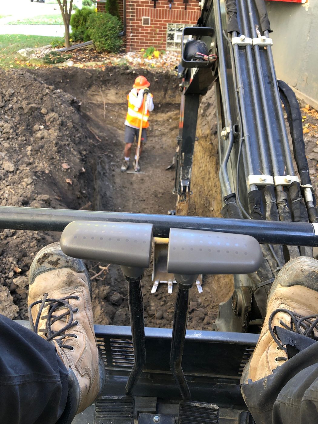 Equipment and crew prepping a commercial site