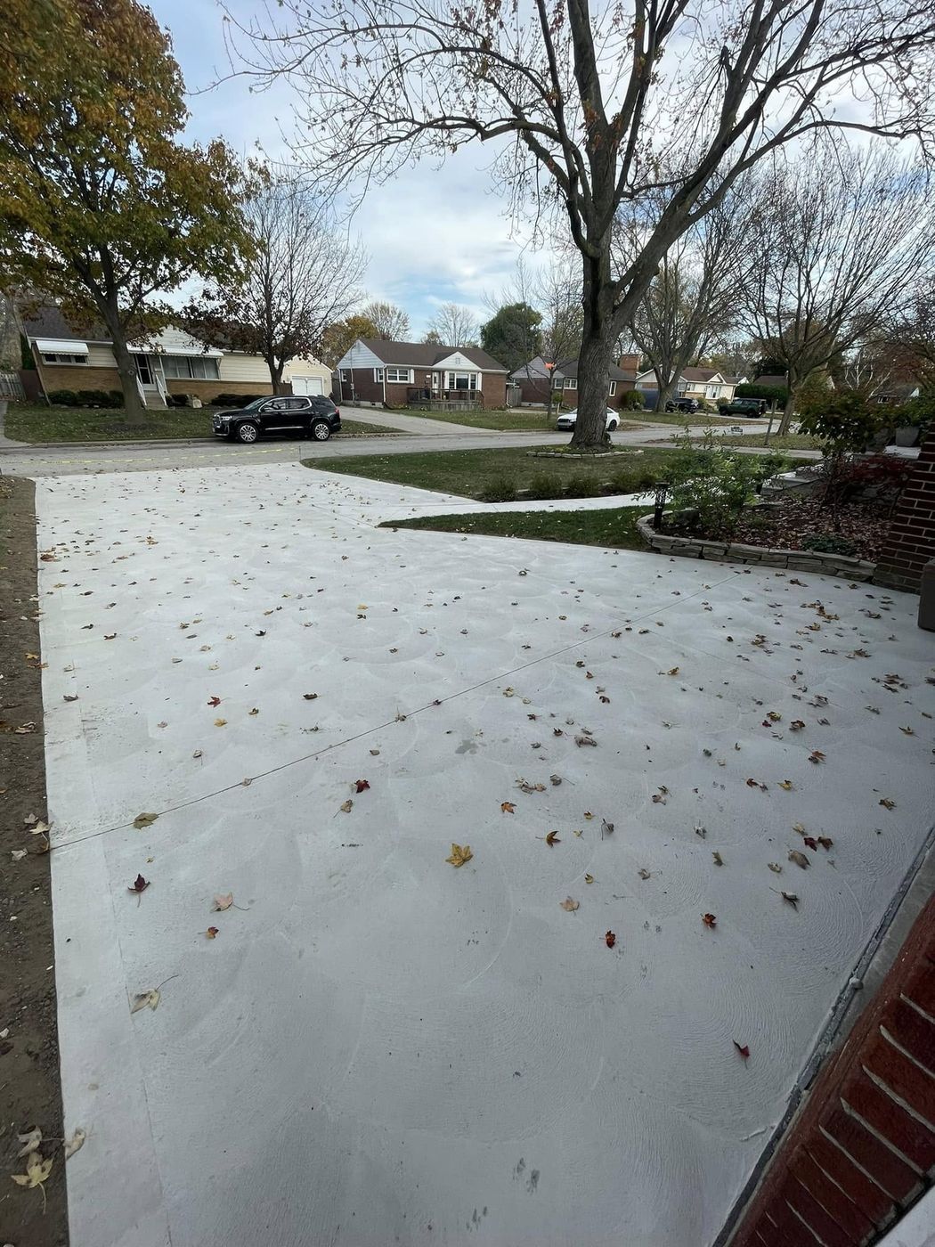 New concrete driveway and approach in autumn