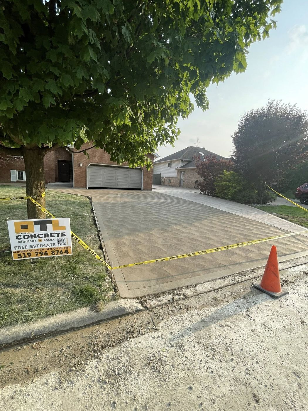 Completed concrete driveway with OTL site sign