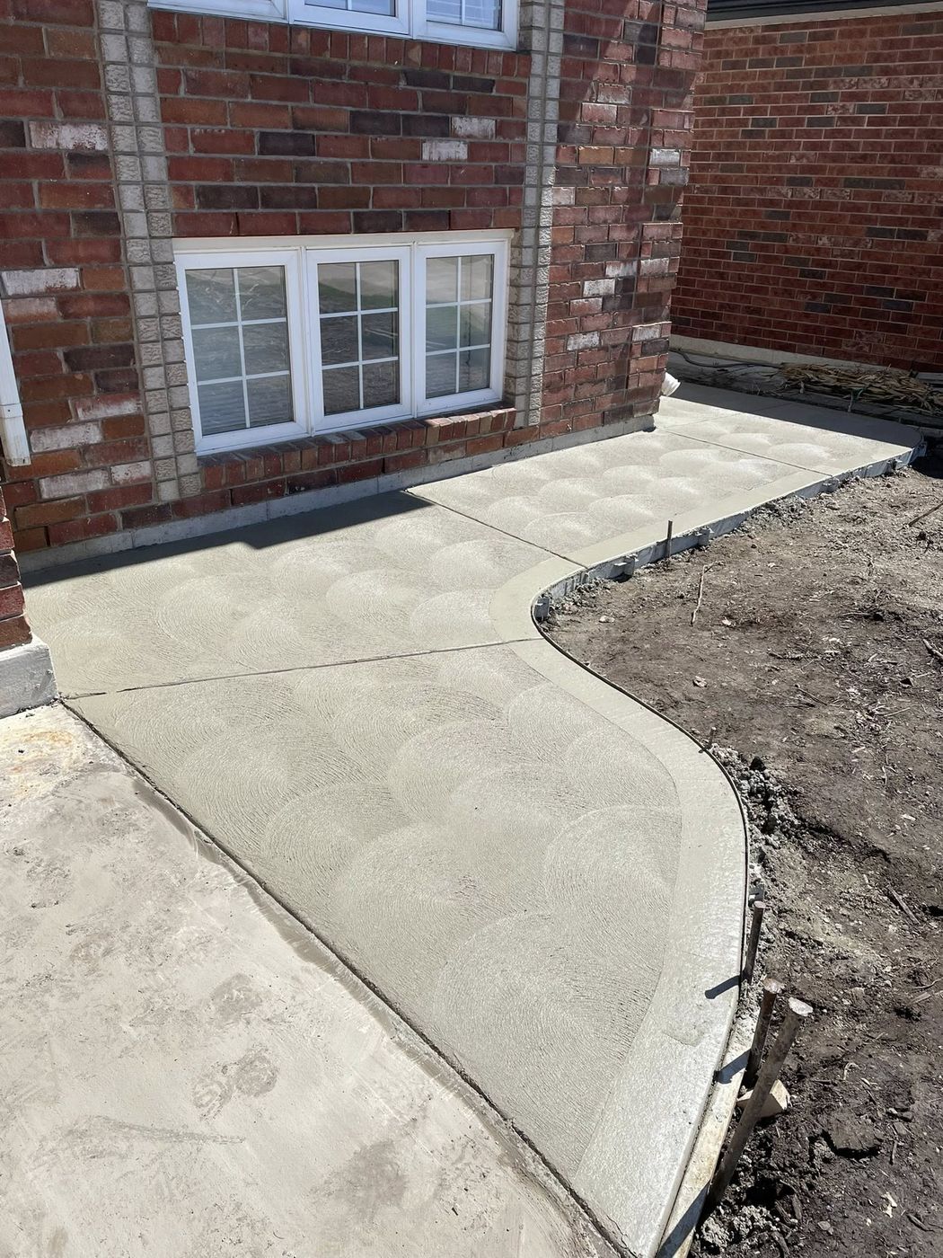 Concrete driveway with integrated front walkway