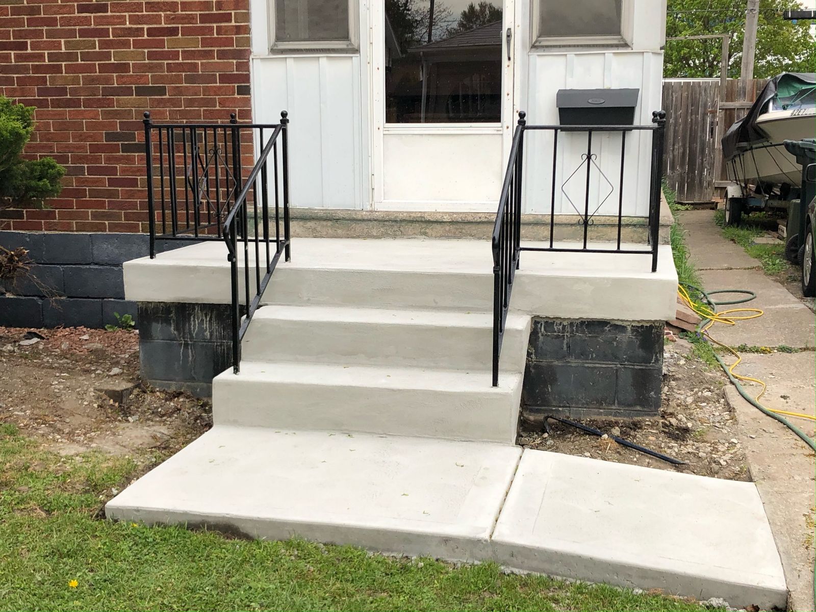 Rebuilt concrete porch steps and walkway