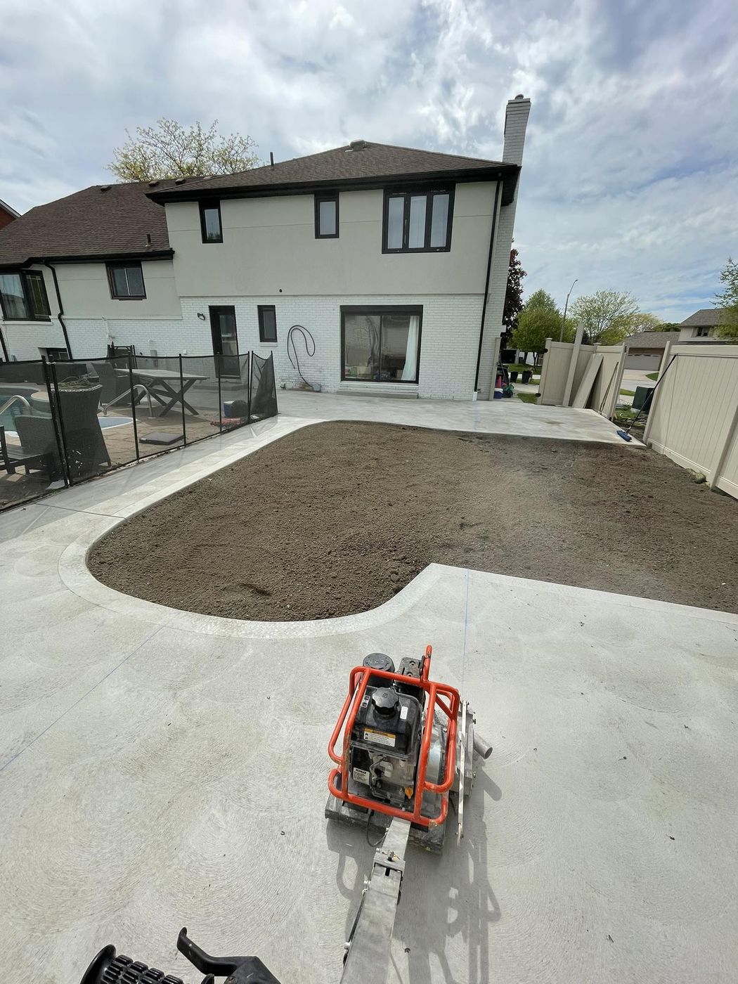 Concrete pool deck with connecting walkway