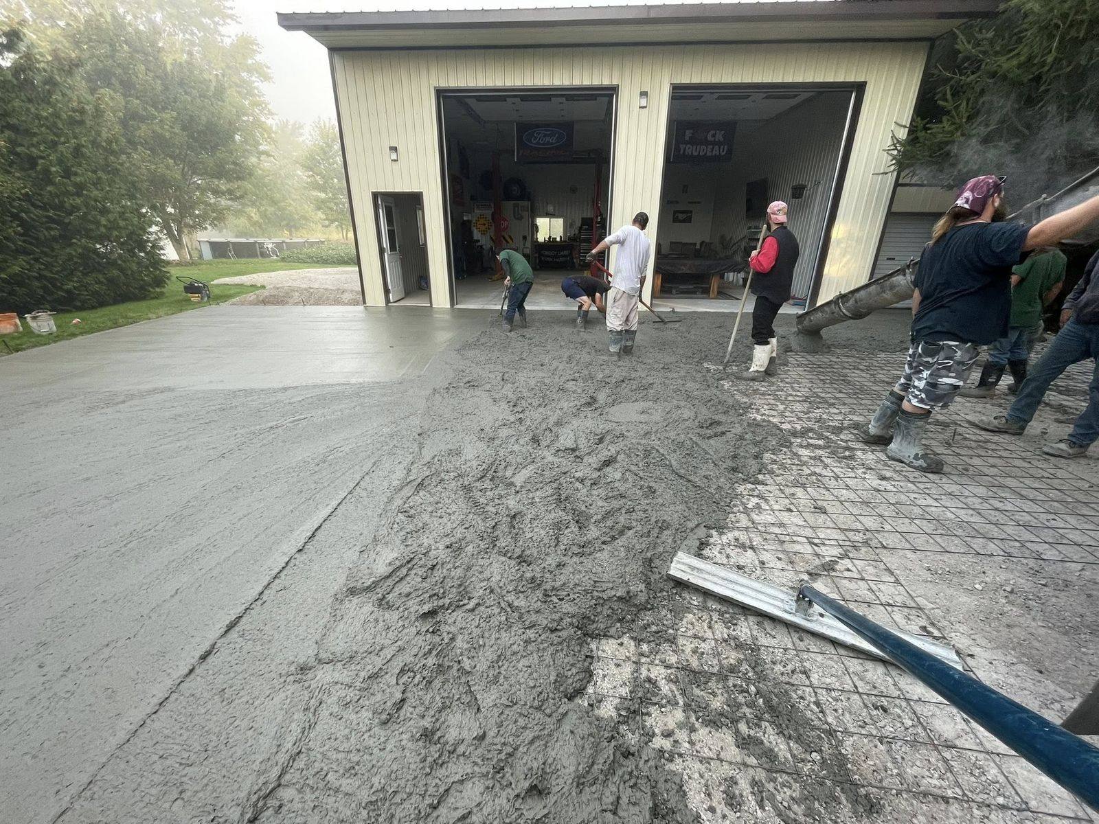 OTL crew screeding a fresh pour