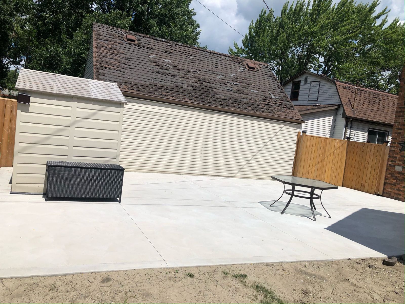 Bright clean-finished backyard concrete slab
