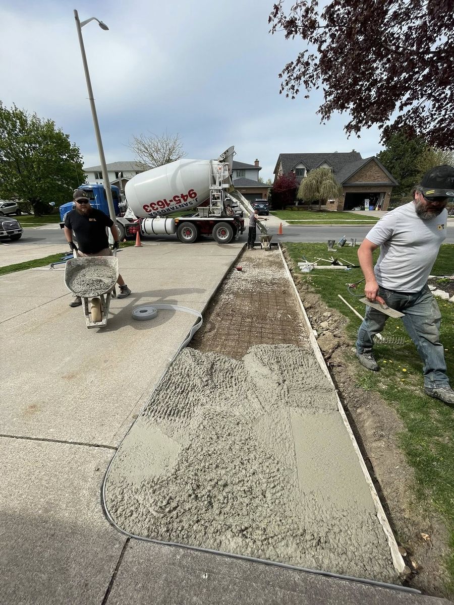 Concrete pouring from the truck chute on pour day