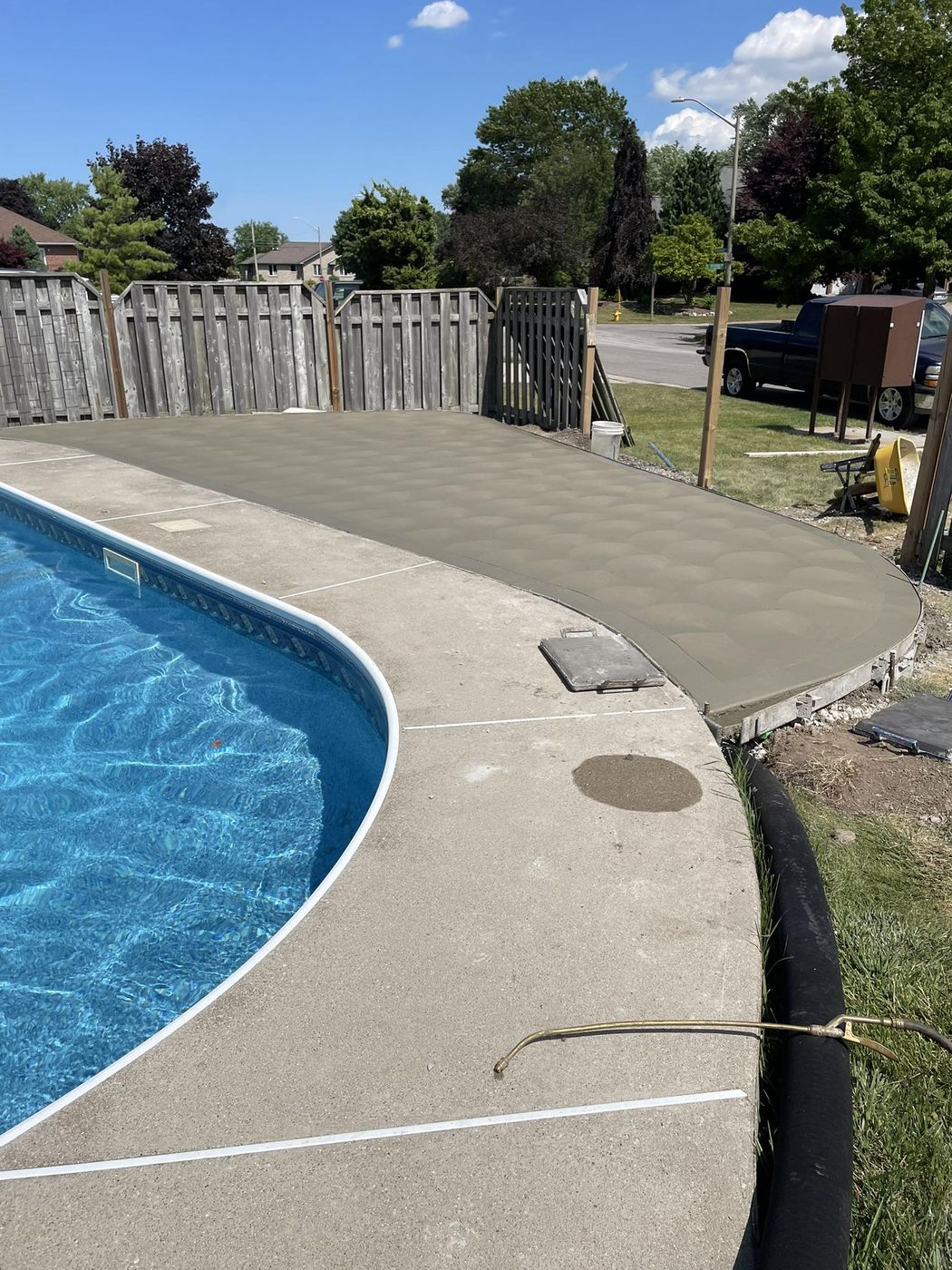 Concrete patio and pool deck with clean saw-cut lines